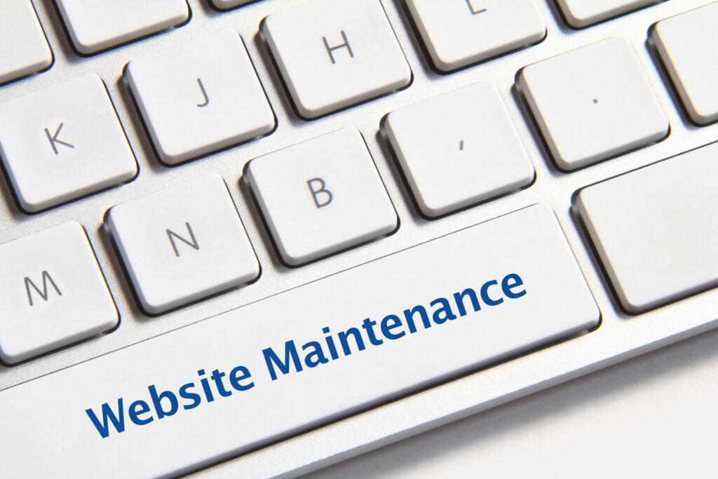 Website maintenance icon on white keyboard button